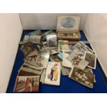 A LARGE COLLECTION OF POSTCARDS IN A CIGAR BOX