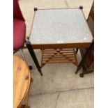 A RETRO COFFEE TABLE WITH FORMICA TOP AND LOWER SLATTED SHELF