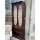 A LARGE MAHOGANY CORNER CABINET WITH TWO LOWER DOORS AND TWO UPPER GLAZED DOORS