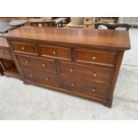 A MODERN MAHOGANY SIDEBOARD WITH THREE SHORT AND FOUR LONG DRAWERS