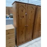 A PINE WARDROBE WITH TWO DOORS