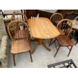 A BEECH DROP LEAF DINING TABLE AND FOUR DINING CHAIRS