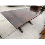 AN OAK DRAW LEAF DINING TABLE