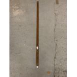 A VINTAGE WOODEN 4FT MEASURING STICK