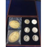 A BOXED SET OF EIGHT LARGE COINS DEPICTING THE NORMANDY LANDINGS