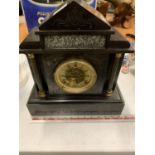 AN ORNATE SLATE MANTLE CLOCK