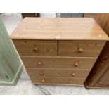A PINE EFFECT CHEST OF TWO SHORT AND THREE LONG DRAWERS