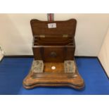 A VICTORIAN WOODEN DESK SET WITH TWO GLASS INKWELLS AND A LETTER RACK