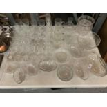 A COLLECTION OF GLASSWARE TO INCLUDE DISHES, DRINKING GLASSES ETC