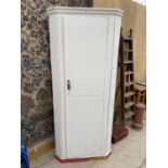 A WHITE PAINTED CORNER WARDROBE