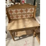 A VICTORIAN PINE TILED BACK WASHSTAND (TWO TILES CRACKED - SPLASHBACK NEEDS RE-ATTACHING)