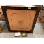 A LARGE VINTAGE WOODEN FRAMED CARROM BOARD WITH A BOX OF COUNTERS