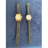 TWO LADIES FASHION WATCHES BOTH WITH BLACK LEATHER STRAP