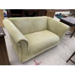 A GREEN TWO SEATER SOFA