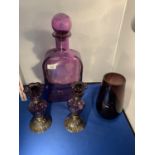 FOUR PIECES OF GLASSWARE TO INCLUDE A PAIR OF CANDLE STICKS, A VASE AND A LARGE BOTTLE WITH STOPPER