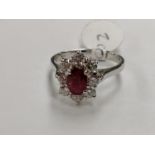 AN 18CT WHITE GOLD DIAMOND AND RUBY CLUSTER RING, TOTAL GEM WEIGHT 1 CARAT, 4.3 GRAMS, INSURANCE