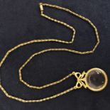 VINTAGE GOLD TONE MAGNIFYING GLASS WITH BOW DECORATION AND CHAIN