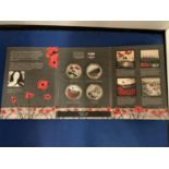 A SET OF FOUR LARGE COINS -THE WAR POPPY COLLECTION