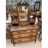A VICTORIAN MAHOGANY DRESSING TABLE WITH FOUR LOWER DRAWERS, FIVE UPPER DRAWERS AND BEVEL EDGE