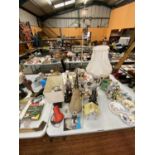 A LARGE COLLECTION OF LAMPS AND CANDLE STICKS TO INCLUDE A HERON, COTTAGE, SPOTLIGHTS ETC