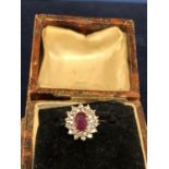 9CT HALLMARKED RUBY AND DIAMOND CLUSTER RING, SIZE H.5. APPROX GROSS WEIGHT 2 GRAMS