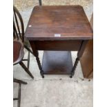 AN OAK SIDE TABLE WITH LOWER SHELF ON BARLEY TWIST SUPPORTS