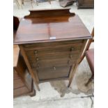 AN EARLY 20TH CENTURY MUSIC CABINET WITH ONE DOOR AND THREE FALL FRONT DRAWERS