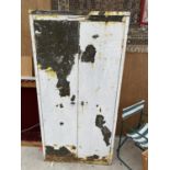 A VINTAGE STEEL INDUSTRIAL CABINET WITH TWO DOORS
