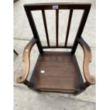 AN OAK CARVER DINING CHAIR WITH SOLID SEAT