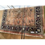 A BROWN PATTERNED RUG