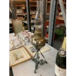 AN ARTS AND CRAFTS BRASS AND METAL OIL LAMP