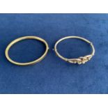 TWO VINTAGE ROLLED GOLD BANGLES ONE WITH A CELTIC KNOT