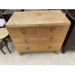 AN OAK CHEST OF TWO SHORT AND TWO LONG DRAWERS