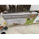 A LARGE BOXED DOG CAGE