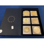 A BOXED SET OF SIX LARGE COINS, THREE OF WHICH DEPICTING THE GIFT OF CHRISTMAS, ONE OF VICTORY,