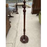 A TURNED MAHOGANY STANDARD LAMP