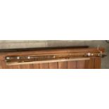 A THREE SECTION ADON SPLIT CANE FISHING ROD IN ROD BAG
