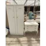 A FRENCH STYLE CREAM WARDROBE AND DRESSING TABLE WITH THREE DRAWERS AND UNFRAMED MIRROR