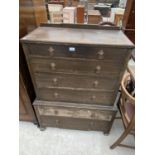 AN OAK CHEST ON CHEST OF SIX DRAWERS