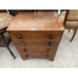 A MAHOGANY COMMODE DISGUISED AS A CHEST OF DRAWERS