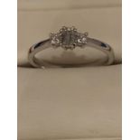 18CT HALLMARKED WHITE GOLD EMERALD CUT & PRINCESS CUT THREE STONE RING SIZE O.5. TOTAL GROSS