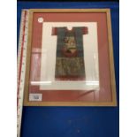 A FRAMED NATIVE AMERICAN INDIAN DOLLS DRESS