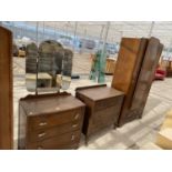 AN OAK WARDROBE, CHEST OF THREE DRAWERS AND DRESSING TABLE