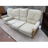 A THREE SEATER SOFA AND ARMCHAIR