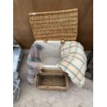 TWO WICKER BASKETS AND TWO PICNIC BLANKETS