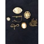 SEVEN MARKED SILVER BROOCHES WITH SHIELD, GALLEON, BOW, CAMEO ETC, TOTAL GROSS WEIGHT APPROX 33