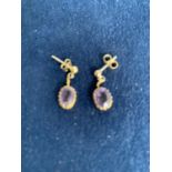 9CT GOLD AMETHYST OVAL DROP EARRINGS. TOTAL GROSS WEIGHT APPROX 2 GRAMS