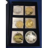 A BOXED SET OF SIX LARGE COINS