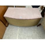 A LLOYD LOOM STYLE OTTOMAN