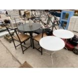 TWO WHITE BISTRO TABLES, A GARDEN TABLE AND FOUR CHAIRS